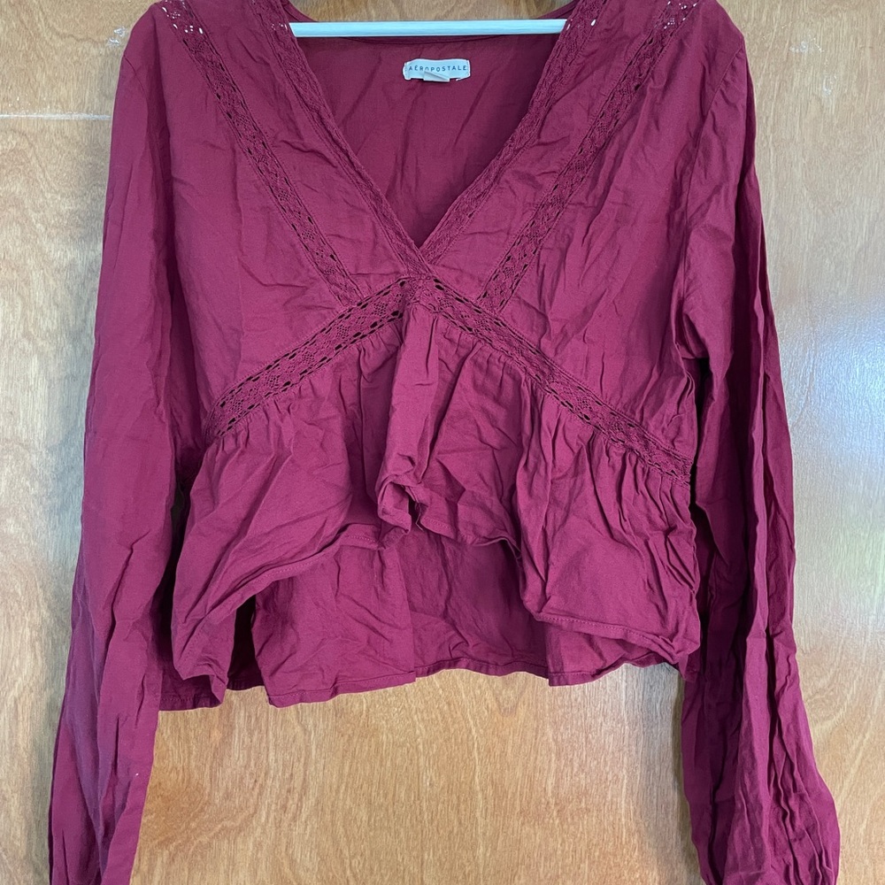 Aeropostale Maroon ruffled lace trim blouse.